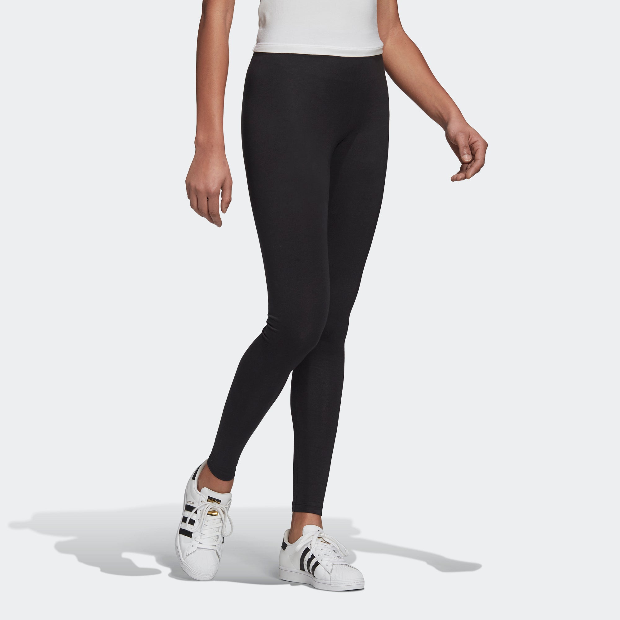 Women's adidas Mid-Rise Leggings Black GD4363 | Chicago City Sports | on model angled view